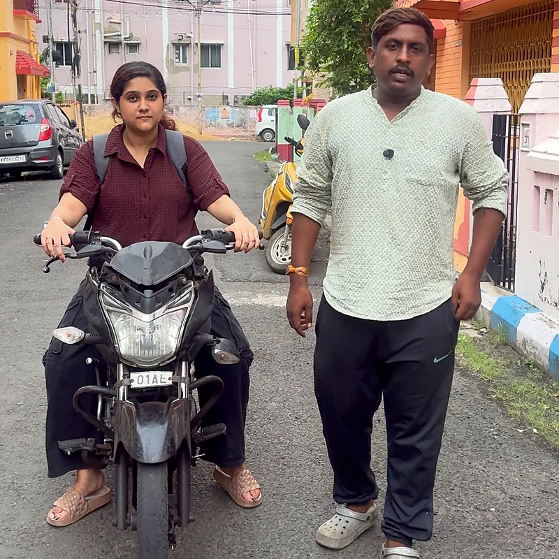 Bike learner with her trainer before a practice ride